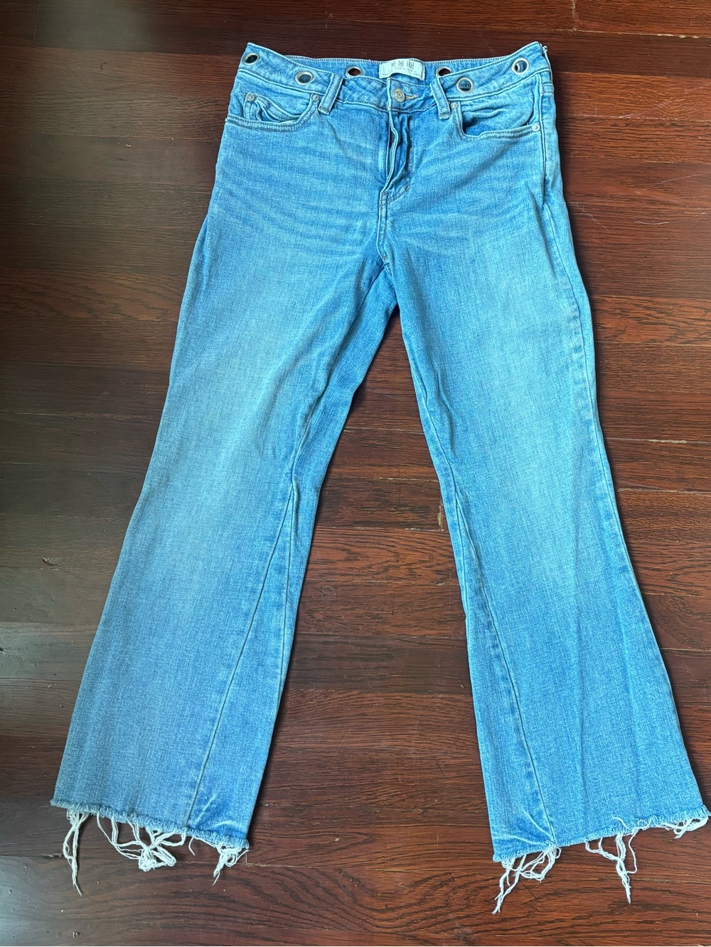 Grommet Flared raw-hemmed We the Free Jeans